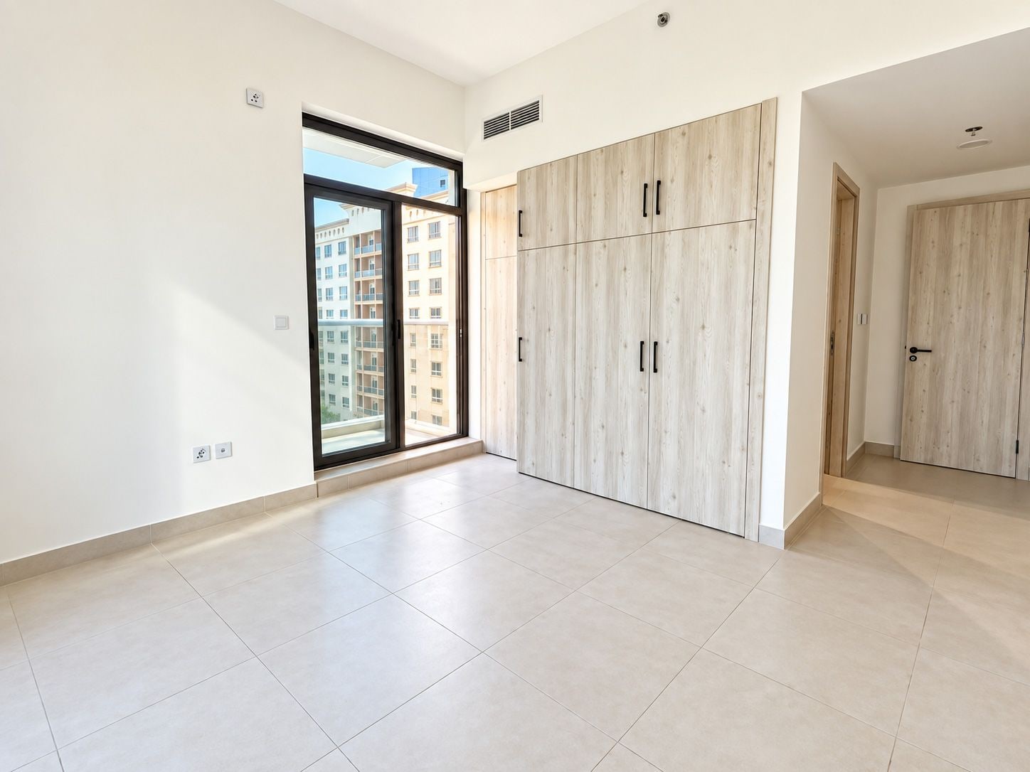 Unfurnished 1 bedroom apartment with skyline view in bliss homes dubai land residence complex dlrc exteriors media item