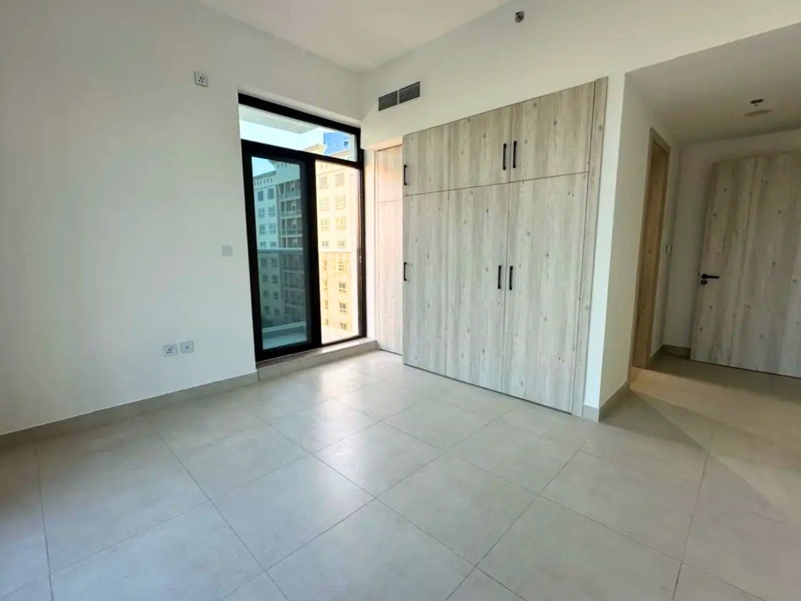 Unfurnished 1 bedroom apartment with skyline view in bliss homes dubai land residence complex dlrc exteriors media item