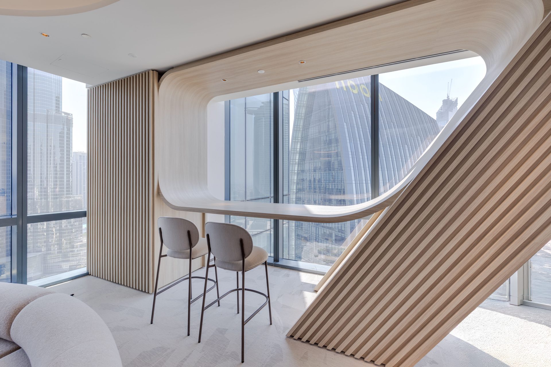 Timber-slat window bar nook overlooking Downtown Dubai
